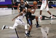 James Harden #13 of the Brooklyn Nets shoots as Paul George #13 of the LA Clippers defends.